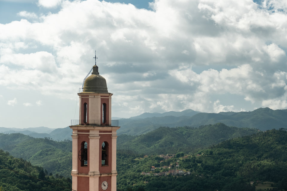 Small town in Liguria with hills as backdrop